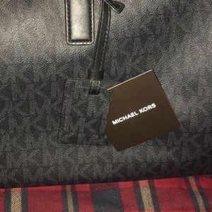Jet black Michael kors duffle bag